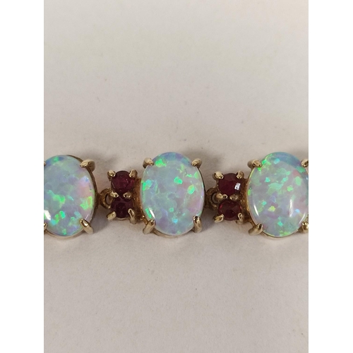 88 - Gold bracelet with oval opals separated by rubies, probably 9ct, 10g.