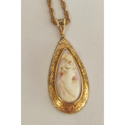 92 - Coral cameo pendant in gold '14k', a garnet pendant with necklets and another, 12g gross.