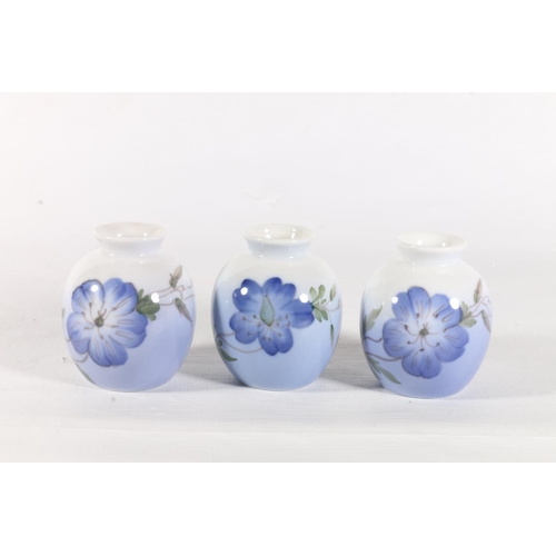 81 - Three small Royal Copenhagen vases decorated with flowers, marked 'NAX, 2800,1259', 6cm.