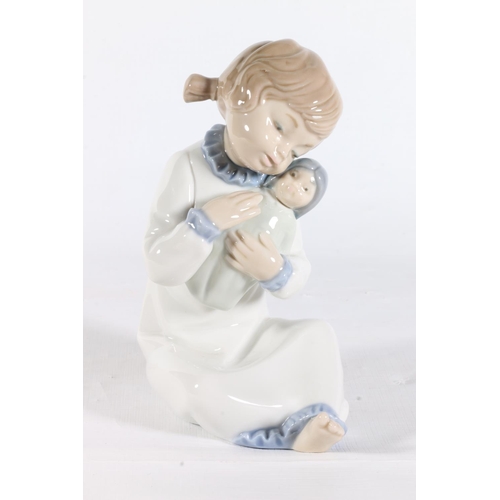 82 - Nao figurine of a child with baby.