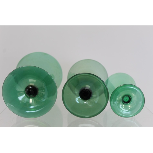 206 - Art Deco green lustre glass part suite of drinking glasses, all with conical bowls on short waisted ... 