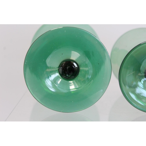 206 - Art Deco green lustre glass part suite of drinking glasses, all with conical bowls on short waisted ... 