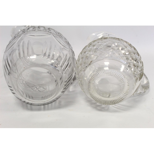 211 - Pair of cut glass wine ewers of baluster form with single scroll handles, blaze, facet and diamond c... 