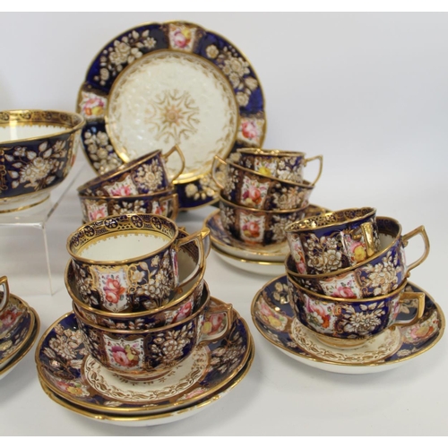 215 - Early 19th century English porcelain part tea set with polychrome painted floral panels on a dark bl... 