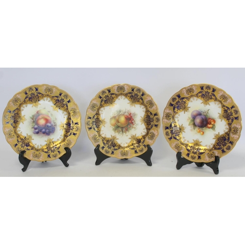 216 - Three Royal Worcester porcelain dessert plates of lobed circular form with hand painted central pane... 