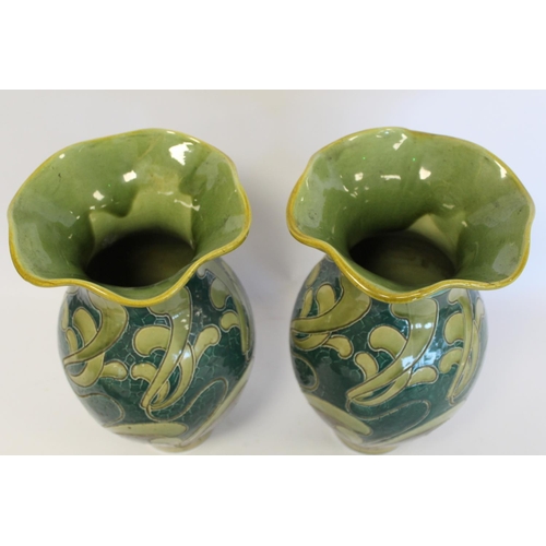 229 - Pair of Burmantofts art pottery vases of baluster form with lobed flared rims and scrolling sgraffit... 