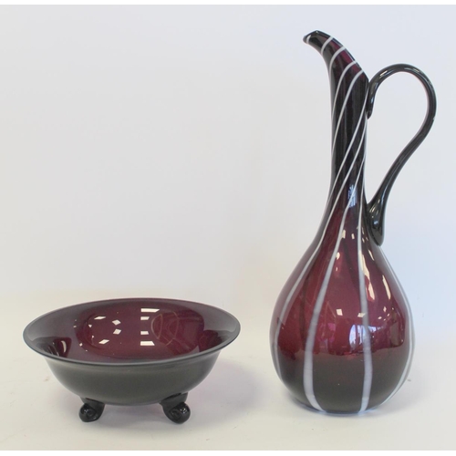 232 - Amethyst art glass ewer of slender form with white striations, snapped pontil mark, 37cm high; also ... 