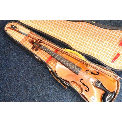 66 - Students violin in case with bow.