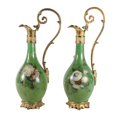 Pair of French green lacquered ewers with hand painted floral decoration, 31cm.