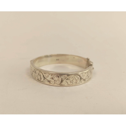 165 - Rolled gold bangle, another silver, two silver brooches, four thimbles and two crowns.