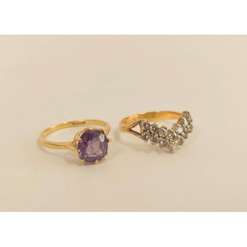 99 - Purple sapphire ring in gold, 18ct and another on 22ct gold shank. 4.7g