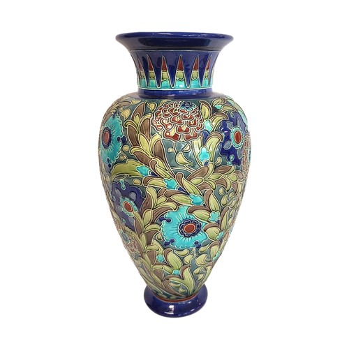 Large Burmantofts Faience art pottery vase of baluster form with tube lined and incised Persian style flowers and scrolling foliage in blue, green and brown glazes, impressed mark Burmantofts Faience England No. 2063 with hand painted mark COL133/4 with additional impressed letter C, 45.5cm high.