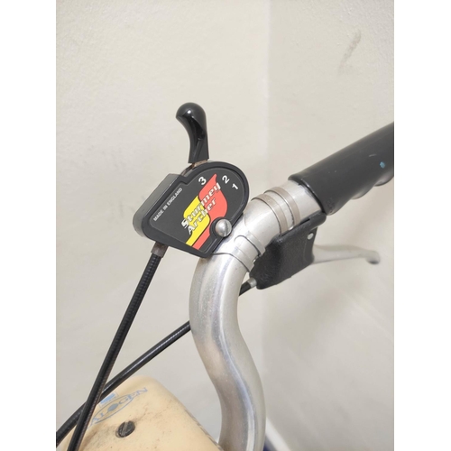 230 - Brompton three speed folding commuter's bicycle in red oxide paint.