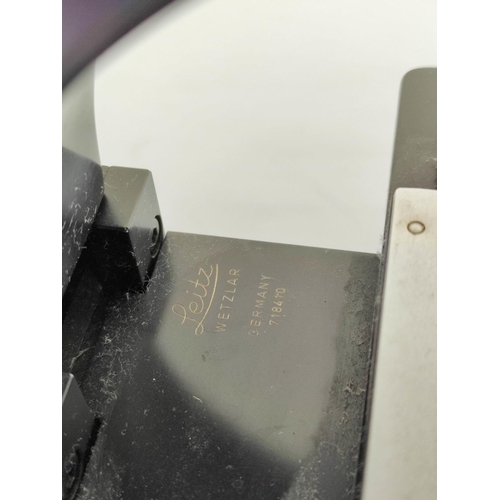 231 - Vintage Ernst Leitz Wetzlar binocular microscope with four rotating lenses. Lacking power supply and... 