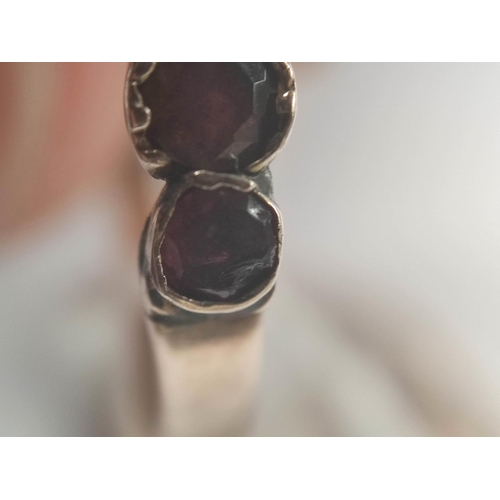 67 - Victorian garnet ring, a diamond solitaire ring and another with four opals, all gold. 8.7g (3).