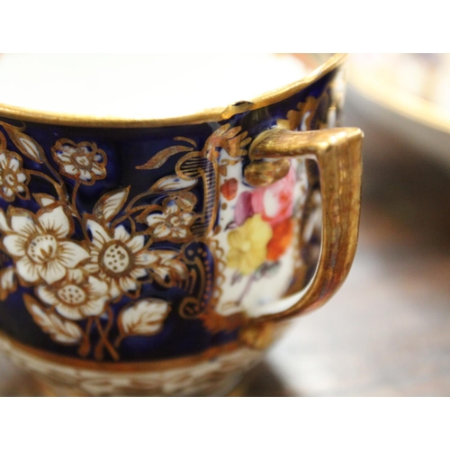 215 - Early 19th century English porcelain part tea set with polychrome painted floral panels on a dark bl... 