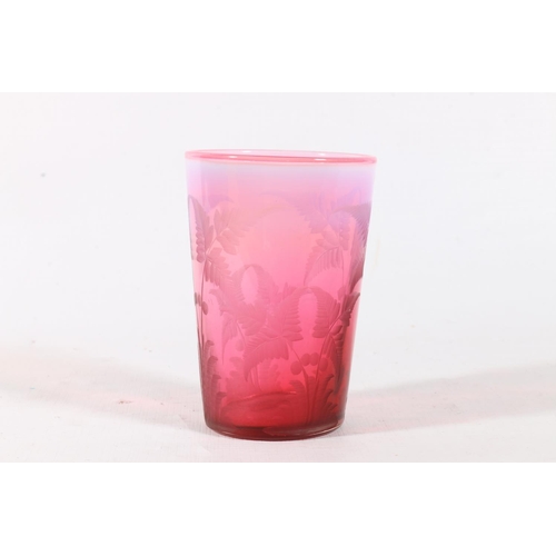 44 - Cranberry vaseline glass beaker with etched fern decoration, 9cm.