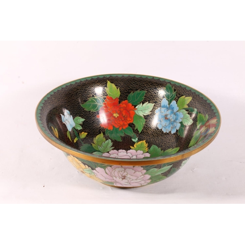 62 - Oriental cloisonne bowl decorated with flowers on black ground, 26cm.