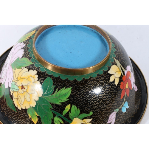 62 - Oriental cloisonne bowl decorated with flowers on black ground, 26cm.