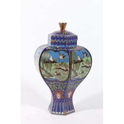 63 - Chinese cloisonne shaped jar and cover decorated with scenes of birds in a landscape, 13cm.