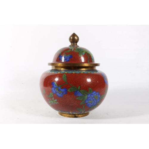 65 - Chinese cloisonne jar and cover decorated with flowers on red ground, 20cm.