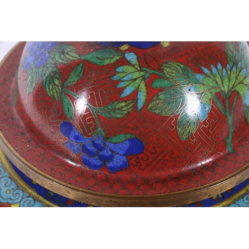 65 - Chinese cloisonne jar and cover decorated with flowers on red ground, 20cm.