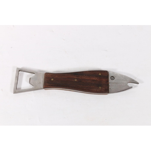 9 - Steel and treen bottle opener of fish form, in the manner of Carl Aubock, 15.5cm.