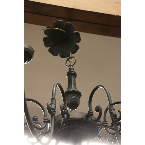 821 - Metal eight branch chandelier.