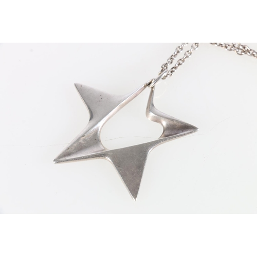 178 - Henning Koppel for Georg Jensen of Denmark - A sterling silver star pendant, number 147, on chain, p... 