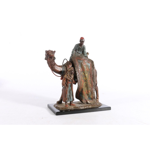 401 - Austrian Bergman style cold painted spelter table lighter in the form of a camel and two Arabian rug... 