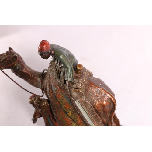 401 - Austrian Bergman style cold painted spelter table lighter in the form of a camel and two Arabian rug... 