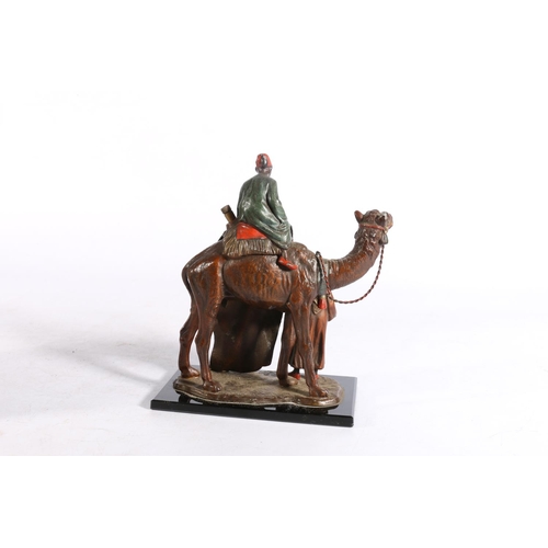 401 - Austrian Bergman style cold painted spelter table lighter in the form of a camel and two Arabian rug... 