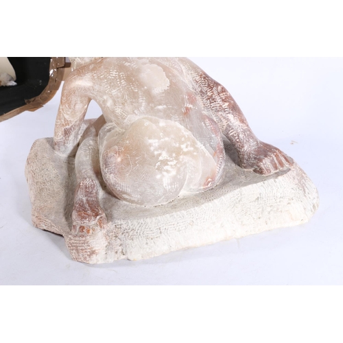 406 - African carved white and pink soapstone sculpture in the form of a crouching nude female figure, uns... 