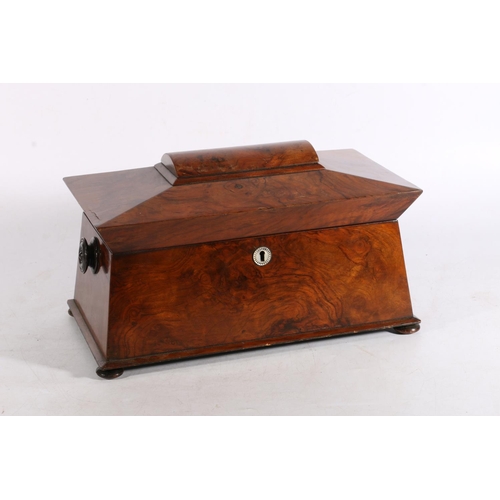 411 - Victorian figural walnut sarcophagus top tea caddy, the lid opening to reveal two lift out tea canni... 