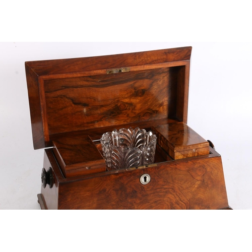 411 - Victorian figural walnut sarcophagus top tea caddy, the lid opening to reveal two lift out tea canni... 