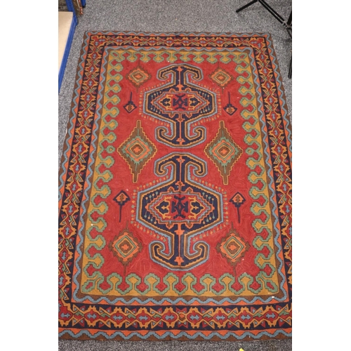 426 - Soumak style Eastern rug, the red field with gul and lozenge decoration, 168cm x 113cm. 