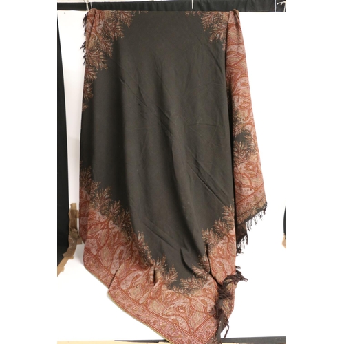 429 - Shawl with black ground having Paisley pattern border, single sided, holed, 166cm x 166cm.