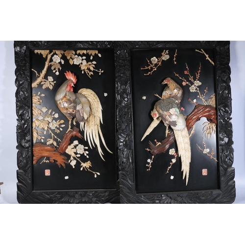 451 - Pair of Japanese Shibayama panels decorated with cockerels perched upon branches, both signed to bot... 