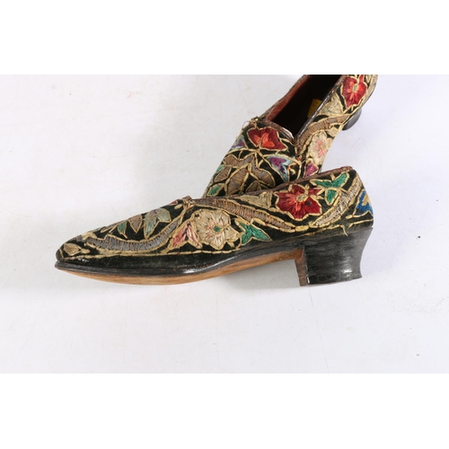 454 - Pair of antique Indian or Persian silk embroidered shoes with all-over floral decoration, 23cm long.