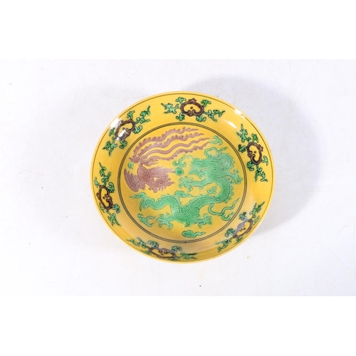 456 - Chinese antique yellow ground saucer with dragon and phoenix decoration, six character mark to base ... 