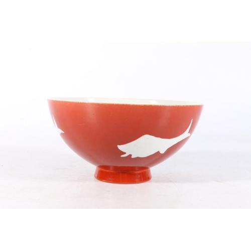 457 - Chinese red ground bowl with fish decoration and six character mark to base, 16cm diameter.