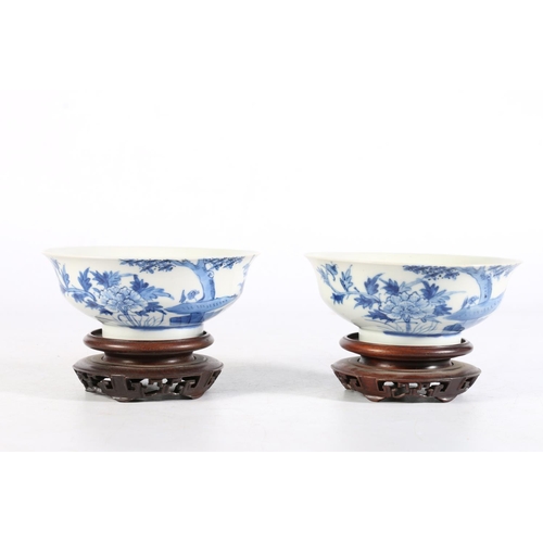 467 - Pair of Chinese blue and white antique bowls on carved hardwood stands, with four character mark to ... 