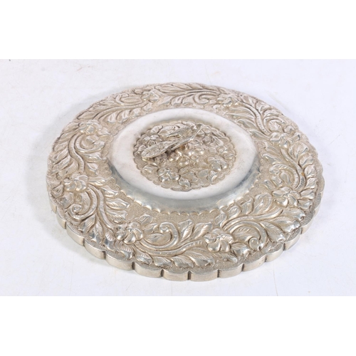 468 - Chinese white metal hand mirror, the body with foliate decoration and bird mount/handle, 22cm diamet... 