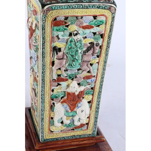 485 - Chinese canton famille noir vase with figures on animals to the body, raised on hardwood stand, fitt... 