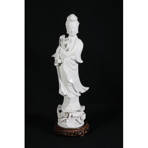 487 - Chinese blanc-de-chine geisha flower girl on hardwood stand, mark to base, 36cm tall.