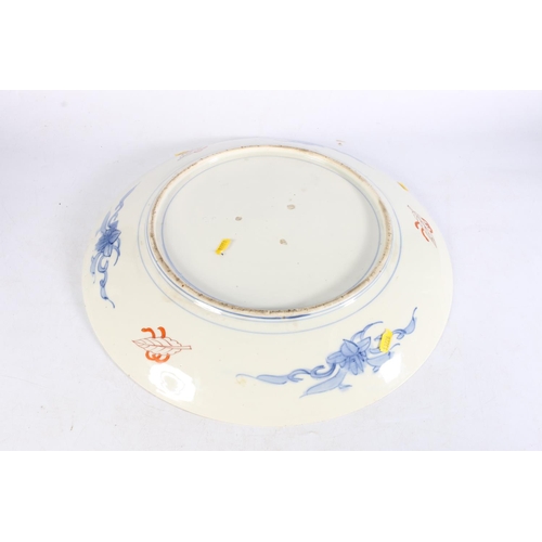 495 - Large Japanese imari charger with blue foliate decoration to central panel, 46cm diameter.