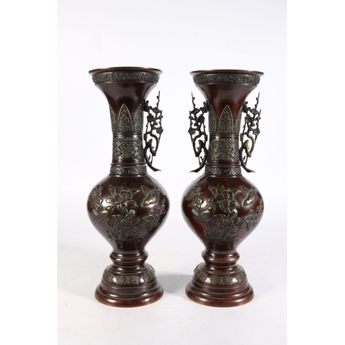 498 - Pair of Chinese bronze foliate decorated twin-handled vases (one handle missing), of archaic form, t... 