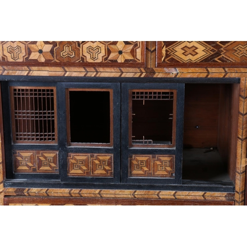 501 - Japanese marquetry tabletop cabinet with seven drawers and sliding panel doors, 46cm x 45cm.