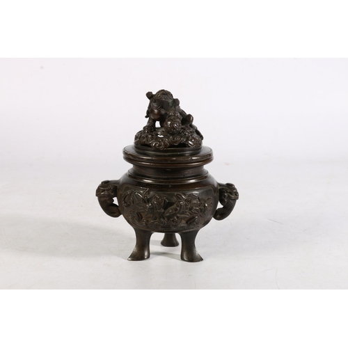 503 - Oriental bronze koro of typical form, the lid mounted with Dog of Fo, and Kylin head handles on trip... 