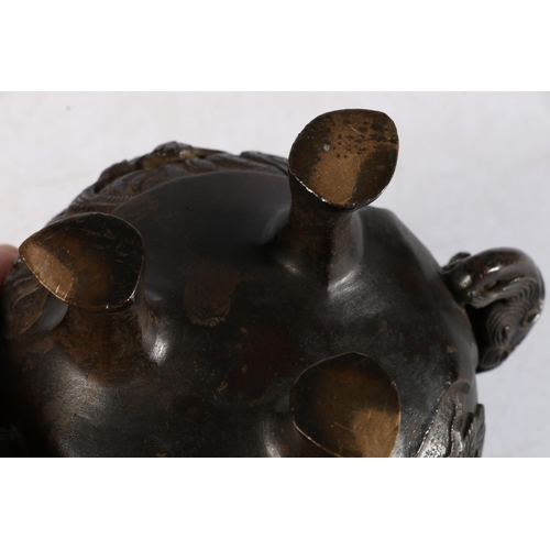 503 - Oriental bronze koro of typical form, the lid mounted with Dog of Fo, and Kylin head handles on trip... 